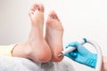 Pedicure master does a hardware peeling of the skin of the feet. Close-up of the heels. The concept of podology and