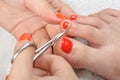 Pedicure process, cuticle cutting Royalty Free Stock Photo