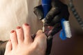 Pedicure removing old coating. Chiropody