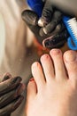 Pedicure removing old coating. Chiropody