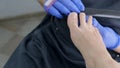 pedicure salon employee uses a nail file during a toe treatment. Close up, selective focus.