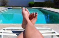 Pedicured Feet Next to the Pool