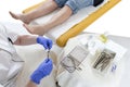 Pedicurist cleaning professional instruments after doing pedicure Royalty Free Stock Photo