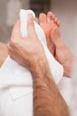 Pedicurist drying a customers feet Royalty Free Stock Photo