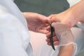 Pedicurist master woman is cutting nails on toes using metal tweezers, closeup. Royalty Free Stock Photo