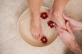 Pedicurist washing a customers feet Royalty Free Stock Photo