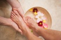 Pedicurist washing a customers feet Royalty Free Stock Photo