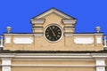 Pediment with a clock of an old Moscow building isolated on a blue background