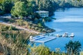 PedrogÃÂ£o Grande PORTUGAL - 10 June 2020 - Bank of the river ZÃÂªzere with floating pool and anchorage for recreational boats Royalty Free Stock Photo