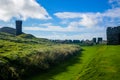 Peel Castle`s tower next to Saint Patrick`s Church at Peel city in Isle of Man Royalty Free Stock Photo