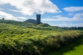 Peel Castle`s tower next to Saint Patrick`s Church at Peel city in Isle of Man Royalty Free Stock Photo