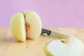 Peel chinese pear by knife on the wooden board