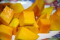 Peel the mango on a plate in the kitchen Royalty Free Stock Photo