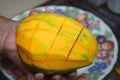 Peel the mango on a plate in the kitchen Royalty Free Stock Photo