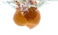 The peel from a whole mandarin thrown into the water. View from under the water Royalty Free Stock Photo