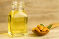 peeled almonds in a spoon and oil