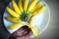 Peeled banana in hand Royalty Free Stock Photo
