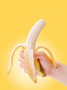 Peeled banana in hand Royalty Free Stock Photo