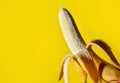 Peel the Deliciousness: Fresh Peeled Banana on Yellow Background