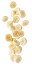 Peeled banana slices are falling down. Vertical picture. Royalty Free Stock Photo