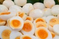 Peeled boiled eggs in both whole and half shape