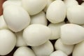 Peeled boiled quail eggs as background, top view