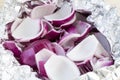 Peeled and chopped red onions in tin foil Royalty Free Stock Photo