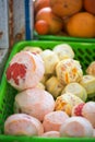 Peeled citrus fruits - limes oranges grapefruits in plastic box, juice stall, Morocco Royalty Free Stock Photo