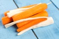 Peeled and cleaned carrots and parsnip on the wooden board Royalty Free Stock Photo