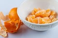 Peeled clementines in bowl