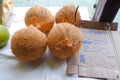 peeled coconut located on the sales table.