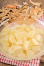 Peeled and diced potatoes in a glass bowl