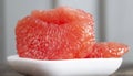 peeled and divided into parts ripe red grapefruit