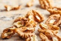 Peeled dried walnut kernels on kitchen table Royalty Free Stock Photo