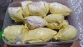 Peeled durian fruit put in the plastic box on the table Royalty Free Stock Photo