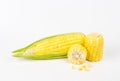 The peeled ear of corn, a piece of and seeds on a white Royalty Free Stock Photo