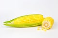 The peeled ear of corn, a piece of and seeds on a white Royalty Free Stock Photo
