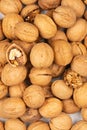 Peeled fresh golden walnuts close up in bulk top view Royalty Free Stock Photo