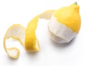 Peeled lemon and lemon zest on white background. Close-up