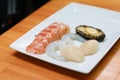 Peeled lobster, shrimp, prawns and abalone on a wooden table. Fresh raw seafood cooking ingredients ready to cook Royalty Free Stock Photo