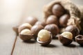 Peeled macadamia nuts  on wood background, Macadamia nuts are loaded with flavonoids and tocotrienols and rich in heart-healthy Royalty Free Stock Photo