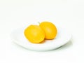 The peeled marian plum is placed in a white plate Royalty Free Stock Photo