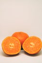 Peeled orange and mandarin slices on white isolated background Royalty Free Stock Photo