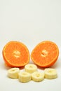 Peeled orange and mandarin slices on white isolated background Royalty Free Stock Photo