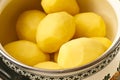 Peeled potatoes in bowl Royalty Free Stock Photo