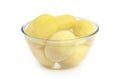 Peeled potatoes in a glass bowl isolated on white Royalty Free Stock Photo