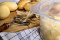 Peeled potatoes and an insert for a food steamer