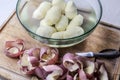 Peeled potatoes peels and knife on cutting board high angle Royalty Free Stock Photo