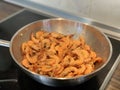 Peeled shrimps are fried in a pan Royalty Free Stock Photo