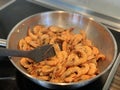 Peeled shrimps are fried in a pan Royalty Free Stock Photo